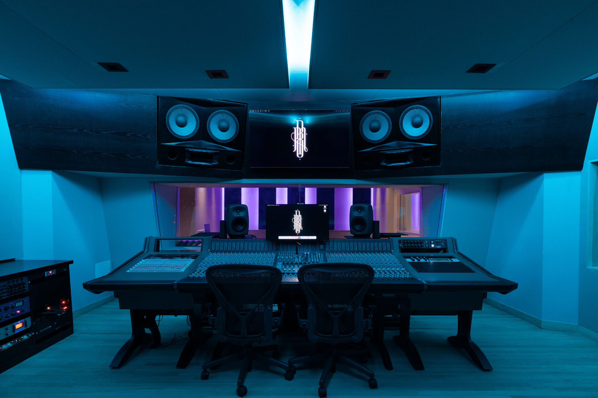 Front-facing view of the Studio B SSL console and main monitoring wall.
