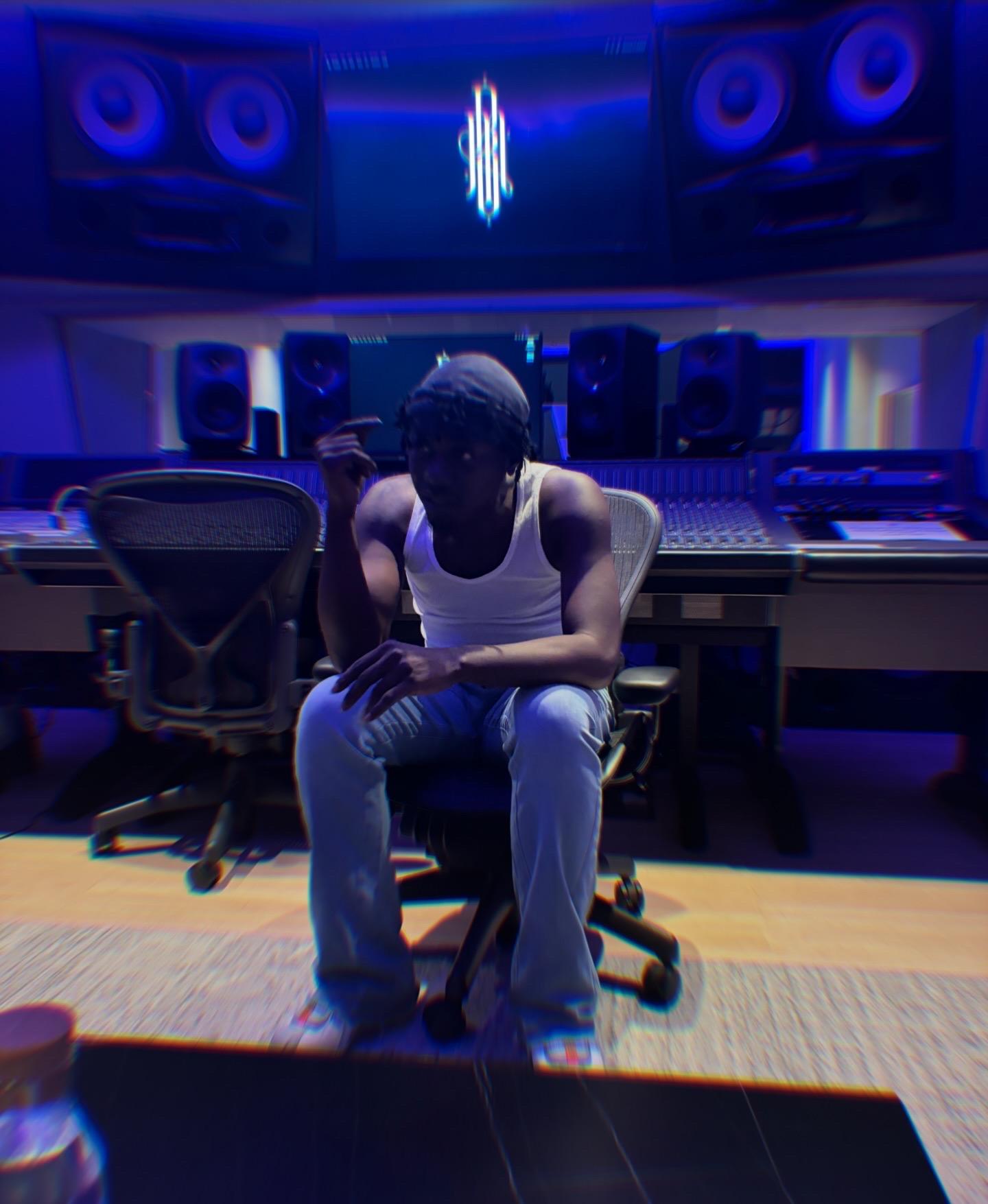 Khali Jah seated at the Studio B console during a session.