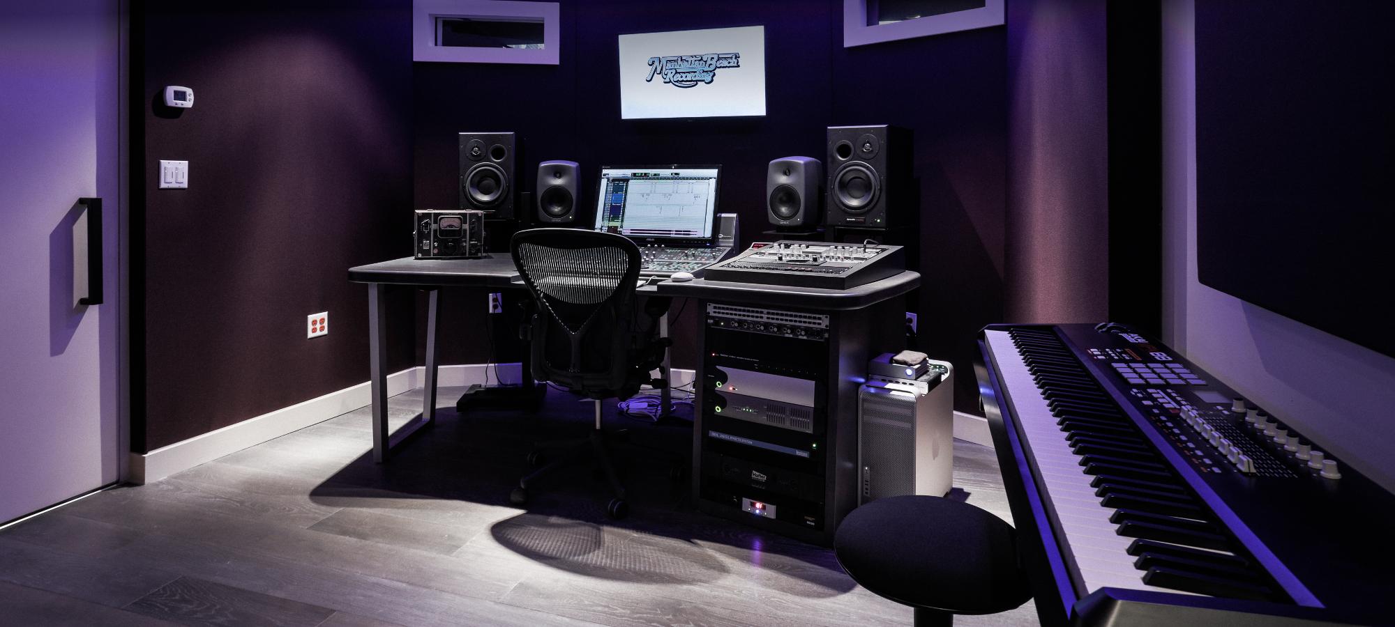 Wide view of Studio E with keyboard and workstation.